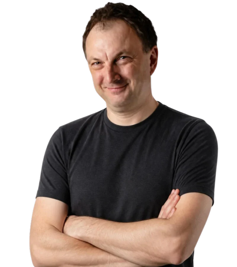 Marcin Borkowski in a dark T-shirt, arms folded